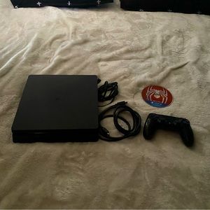 PS4 console with spider man disc and power cords really haven’t used it no more